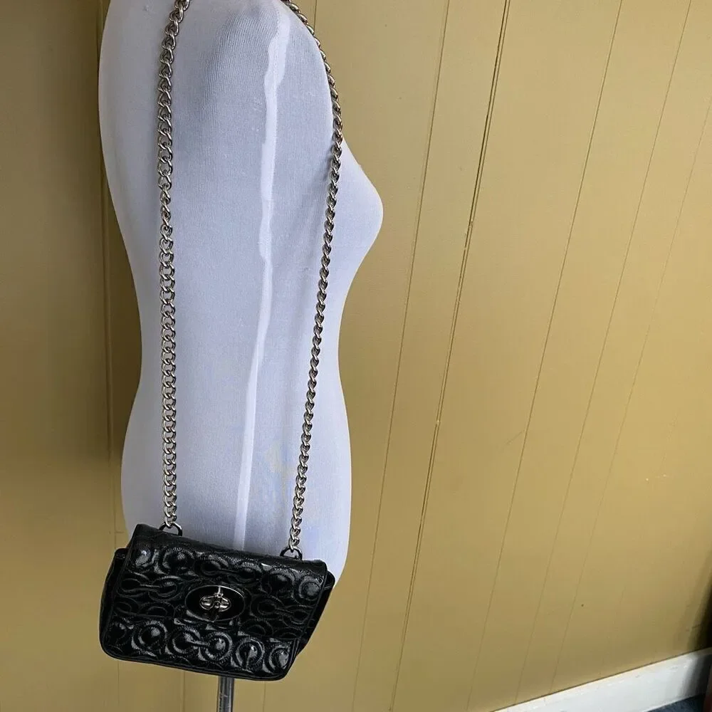 Coach mini shoulder/crossbody bag w/twist latch closure w/satin inner lining